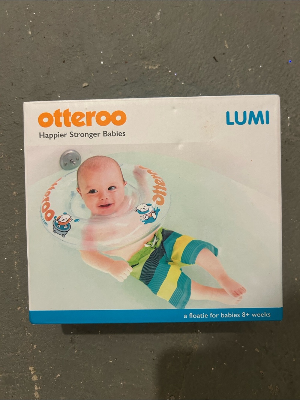 Otteroo Lumi Baby Neck Float - Clear with Orange and Blue Accents
